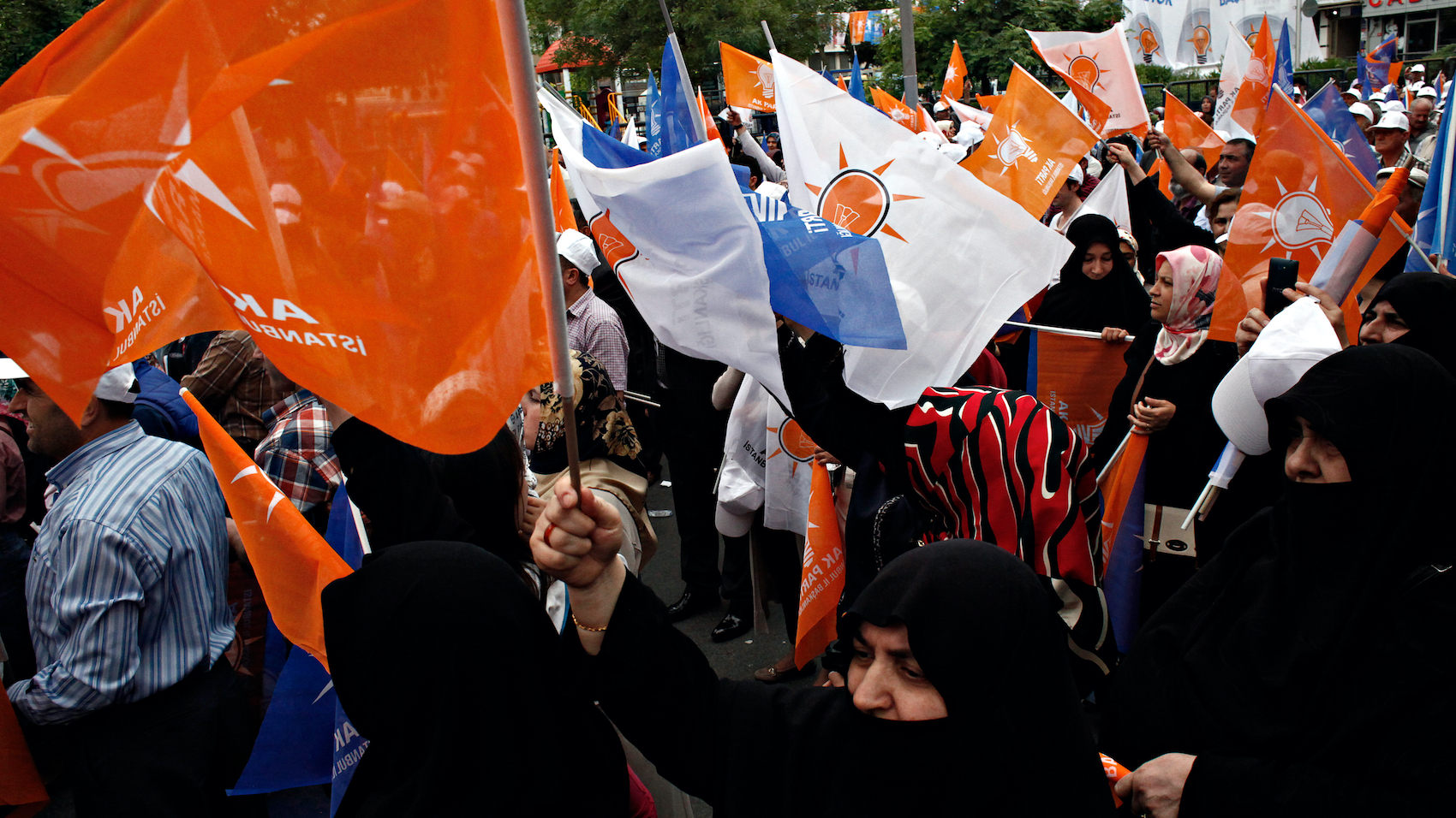 Supporters of ruling Justice and Development Party (AKP) wave party flags during an election rally in Istanbul on June 3, 2015.
