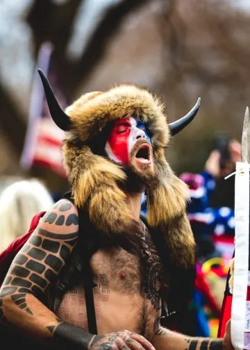QAnon Shaman, Jake Angeli is seen as roaming near the US Capitol during the January 6, 2021 insurrection which was initiated by Former US President Donald Trump in Washington D.C.. Photo: Johnny Silvercloud