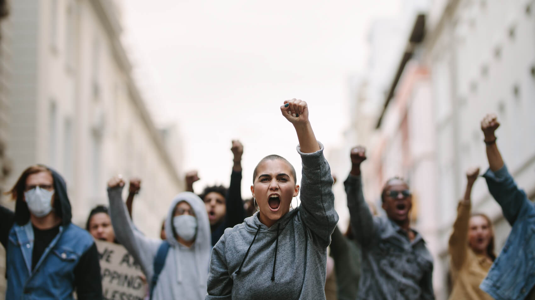 Group of people protesting and giving slogans in a rally. Photo: Jacob Lund.
