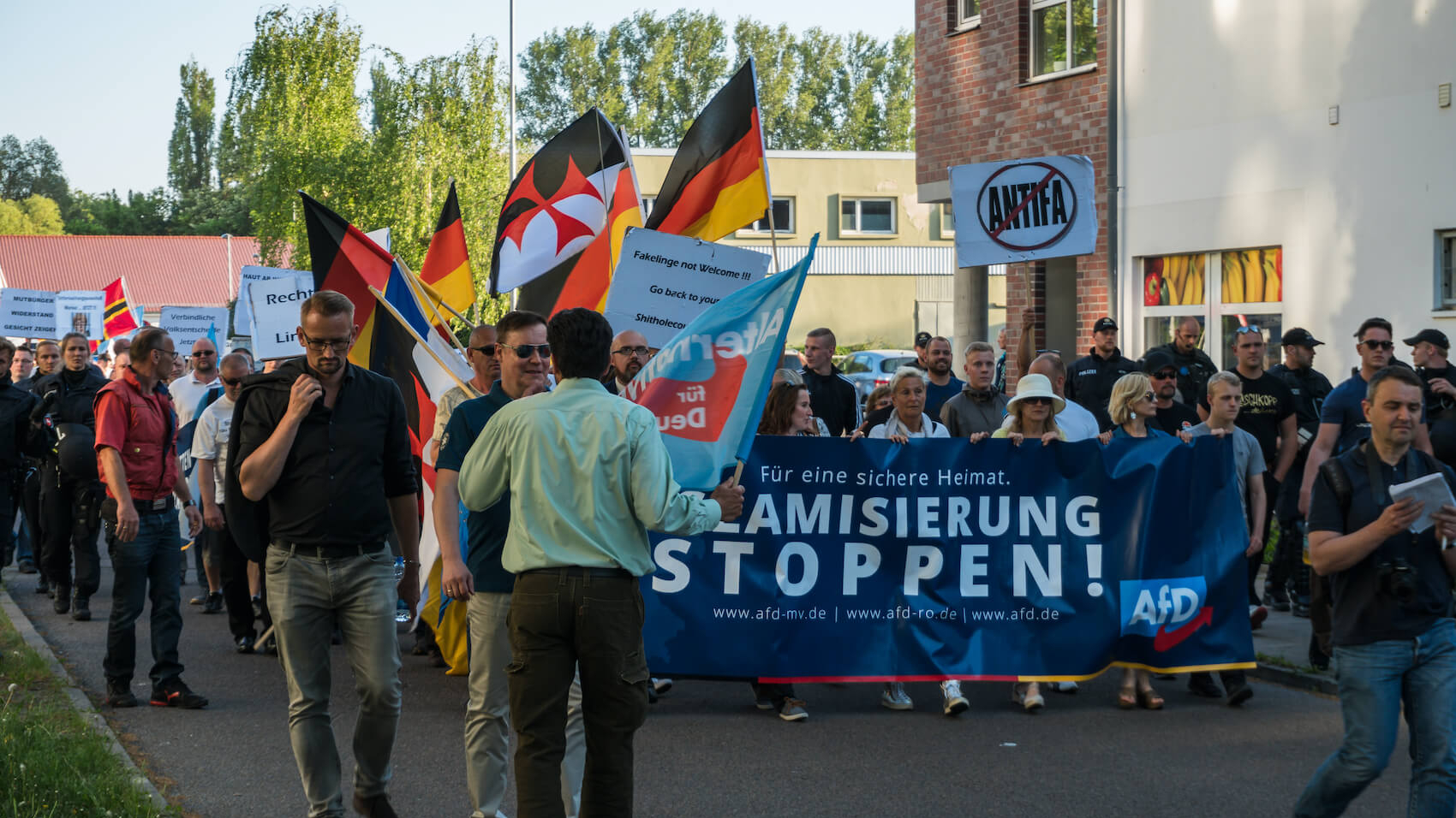 AfD demo with slogan Stop Islamization and counter demonstration of the Left in Luetten Klein in Rostock, Germany on May 14, 2018. AfD, Alternative for Germany, is a right wing political party in Germany. Photo: Shutterstock.