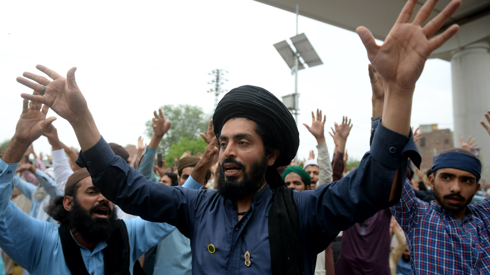 Supporters of the Tehreek-e-Labaik Pakistan (TLP) chant slogans as they protest against the arrest of their leader in Lahore, Pakistan on April 16, 2021. Photo: A.M. Syed