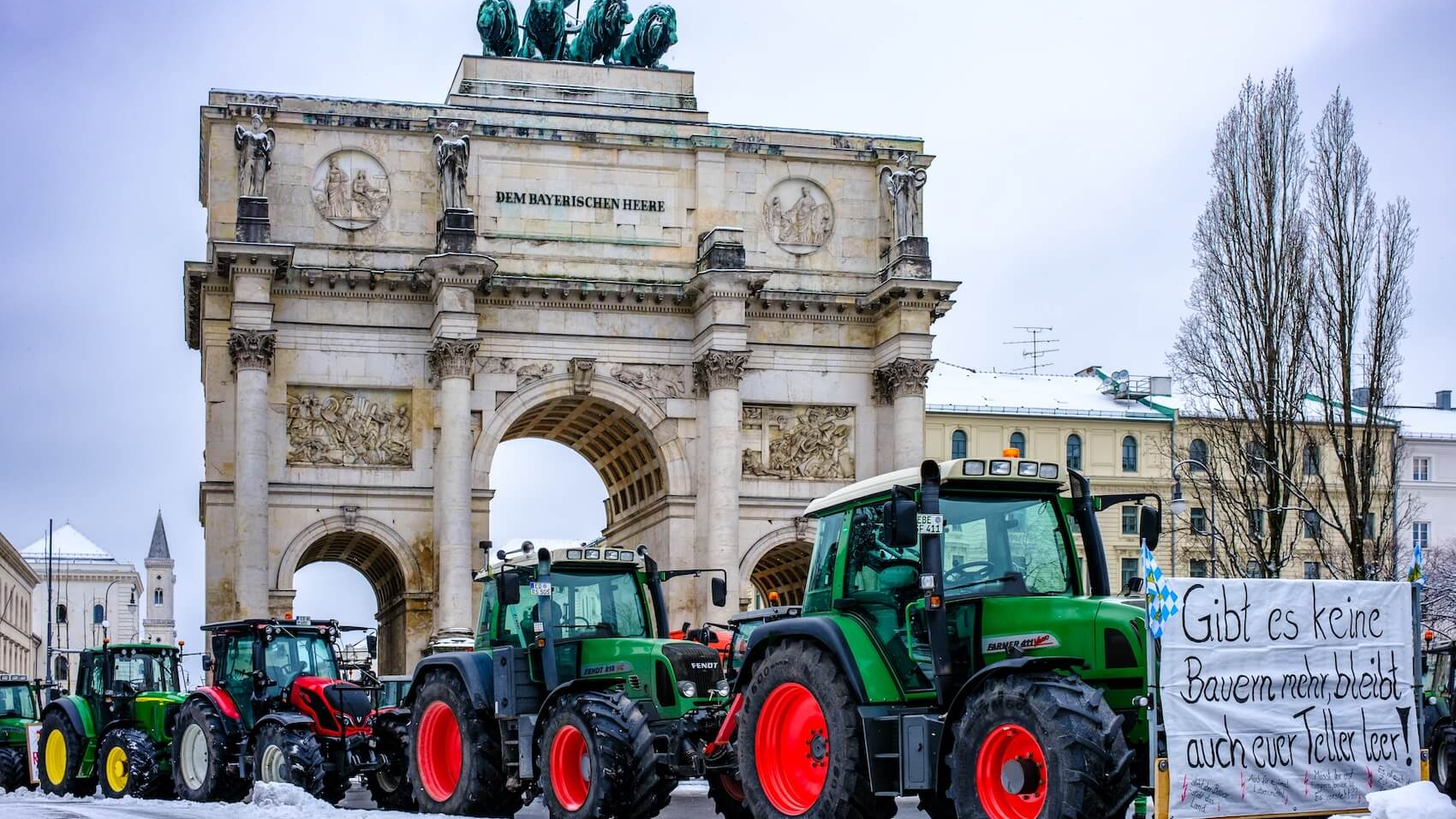 Tractors with posters of farmers protesting against the government's measures at the Ludwig Street in Munich, Germany on January 8, 2024. Photo: Shutterstock.