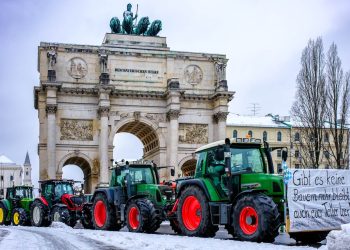 Tractors with posters of farmers protesting against the government's measures at the Ludwig Street in Munich, Germany on January 8, 2024. Photo: Shutterstock.