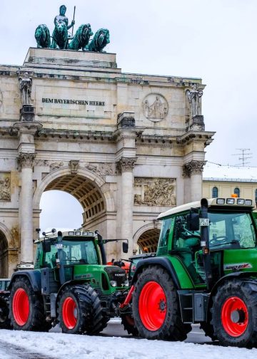 Tractors with posters of farmers protesting against the government's measures at the Ludwig Street in Munich, Germany on January 8, 2024. Photo: Shutterstock.