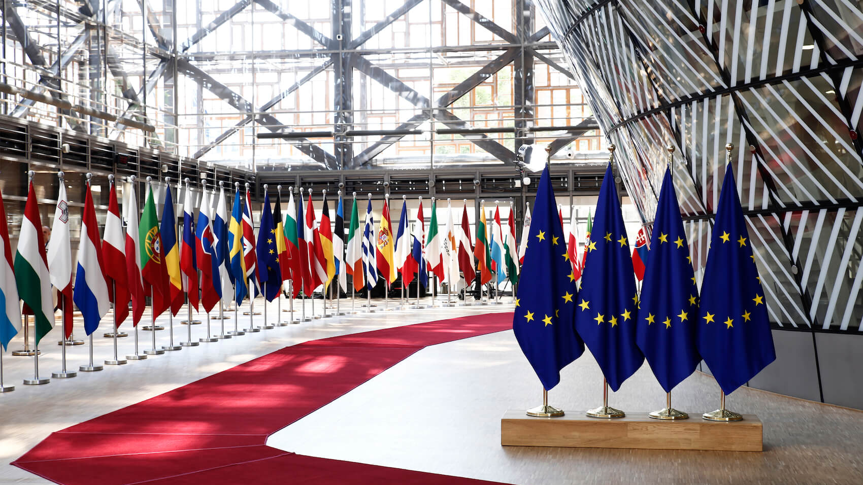 EU flags in EU Council building during the EU Summit in Brussels, Belgium on June 28, 2018. Photo: Alexandros Michailidis.