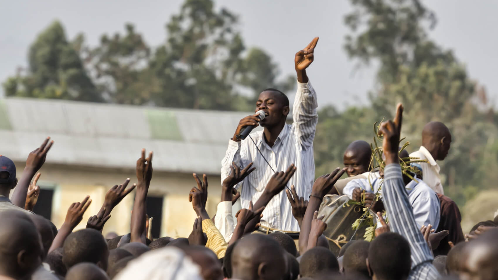 Young activists participate in an opposition rally during the Ugandan presidential elections, organized by the FDC (Forum for Democratic Change), opposing the ruling party NRM in Mbale, Uganda on February 14, 2011. Photo: Shutterstock.