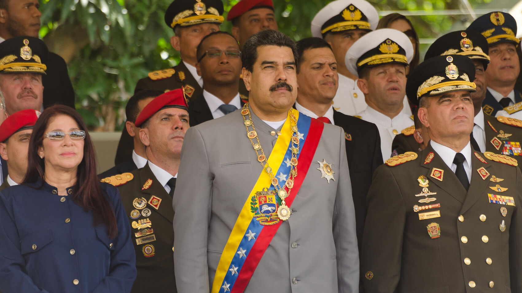 Nicolás Maduro (center) with First Lady Cilia Flores (left) and Defense Minister Vladimir Padrino López (right), in a militar parade in Caracas on February 1, 2017. Photo: Shutterstock.