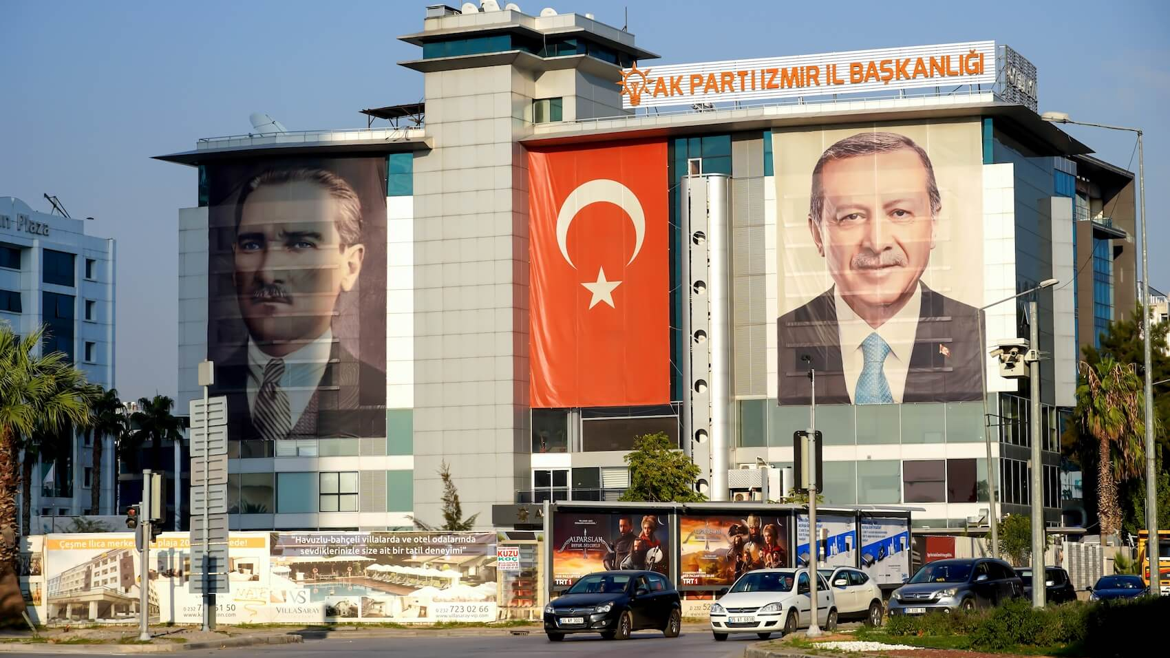 A view of the AKP's Izmir Provincial Directorate. The Turkish flag, along with posters of Erdogan and Ataturk, are seen together on the front of the building on October 30, 2021, in Bayrakli, Izmir. Photo: Idil Toffolo.