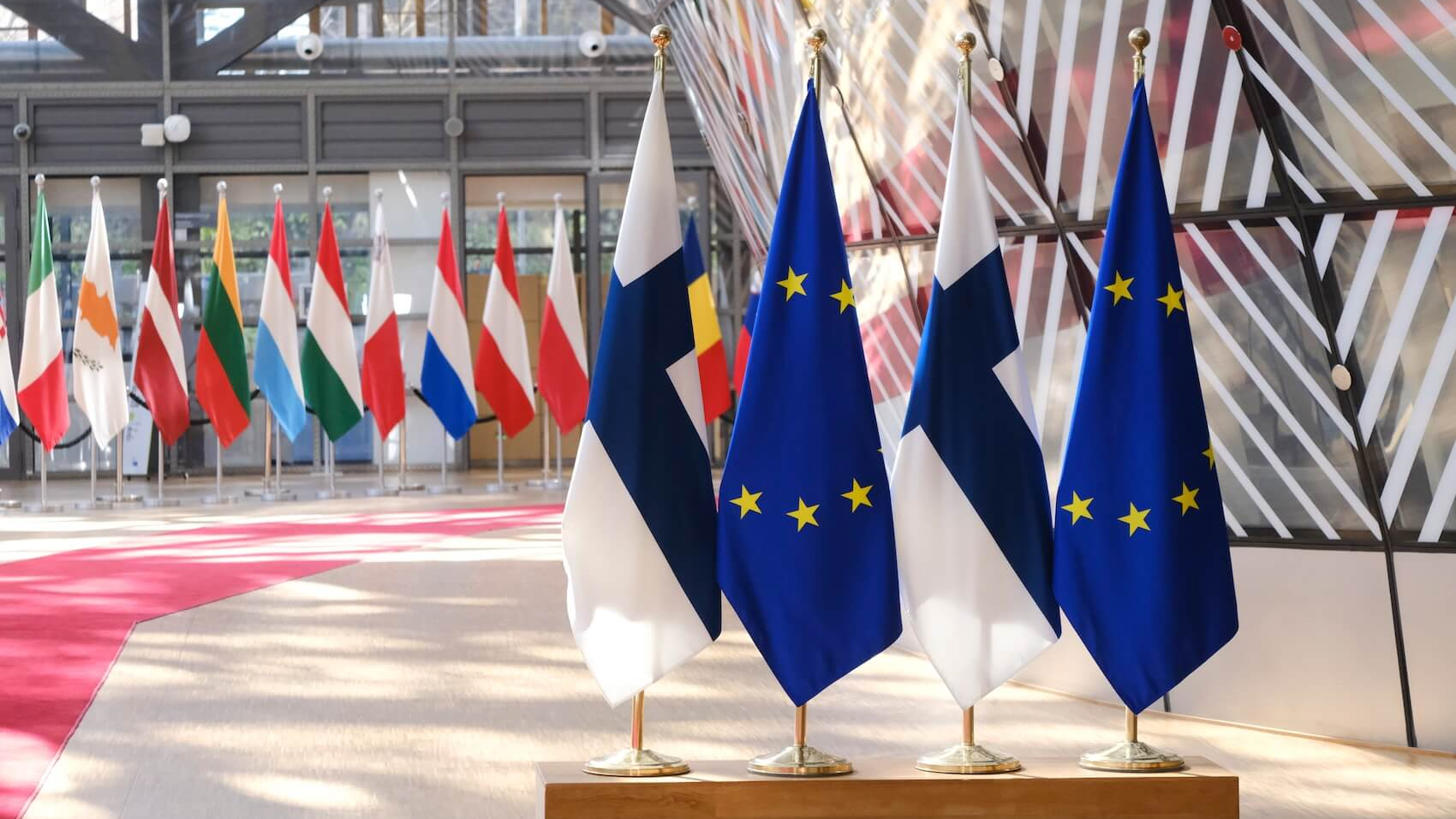Flag of Finland and the European Union flag displayed in the European Council offices in Brussels, Belgium, on April 10, 2024. Photo: Alexandros Michailidis.