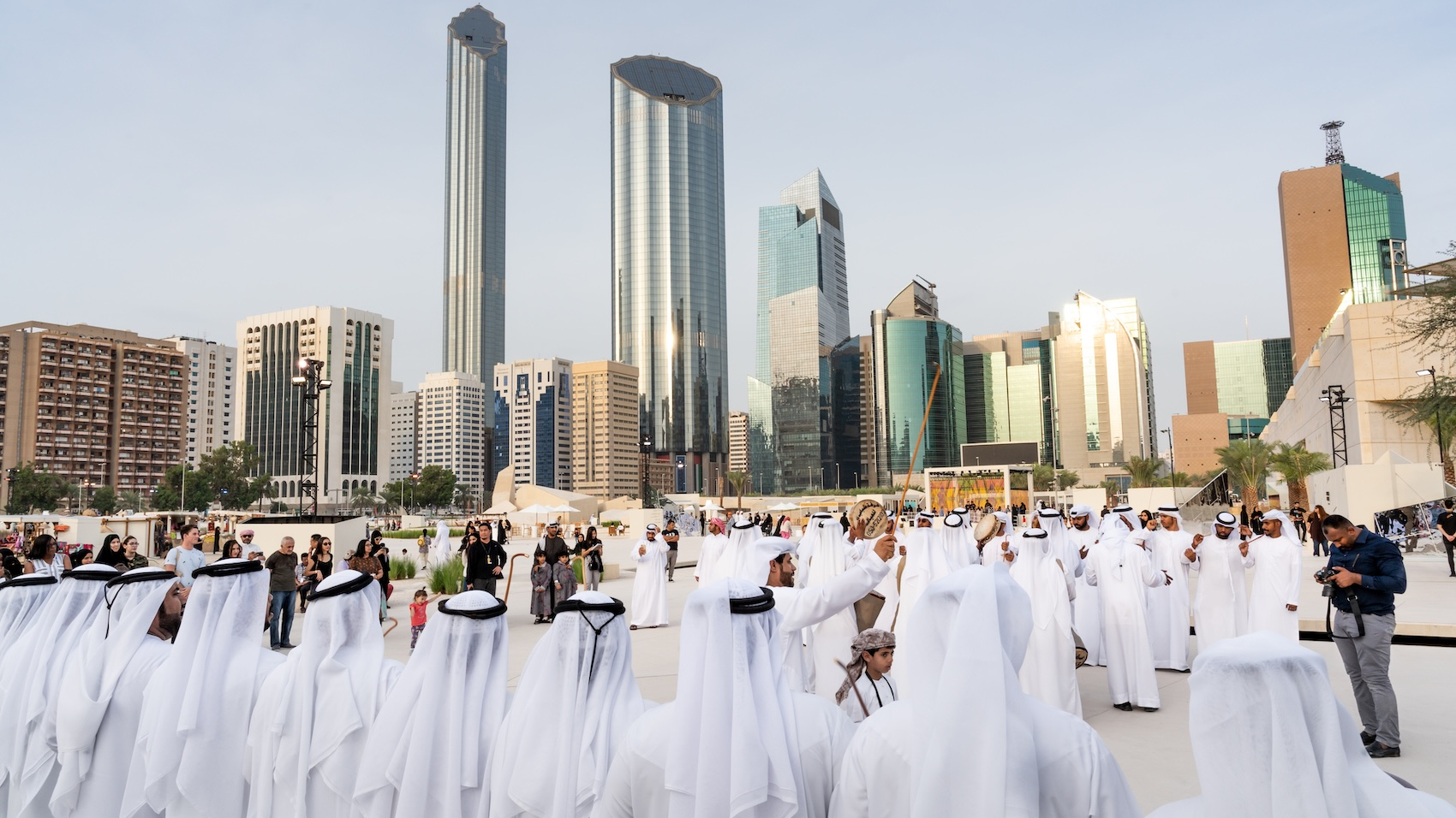 Emirati men perform the traditional Al Ayala dance in Abu Dhabi, UAE, on December 23, 2019. Photo: Shutterstock.