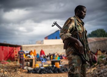 Soldier on duty to protect people during dinner in Baidoa, Somalia on May 15 2019. Photo: Shutterstock.