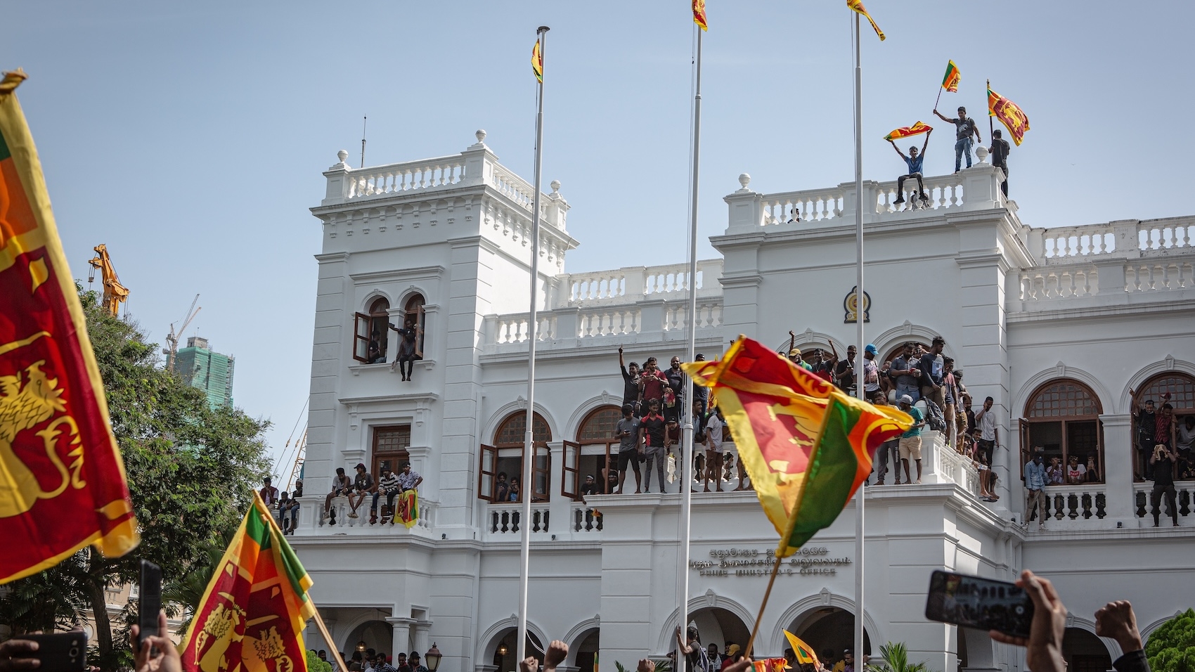 Sri Lankan protesters storm the prime minister's office in Colombo on July 13, 2022, demanding the resignation of President Gotabaya Rajapaksa and Prime Minister Ranil Wickremesinghe. Photo: Ruwan Walpola.
