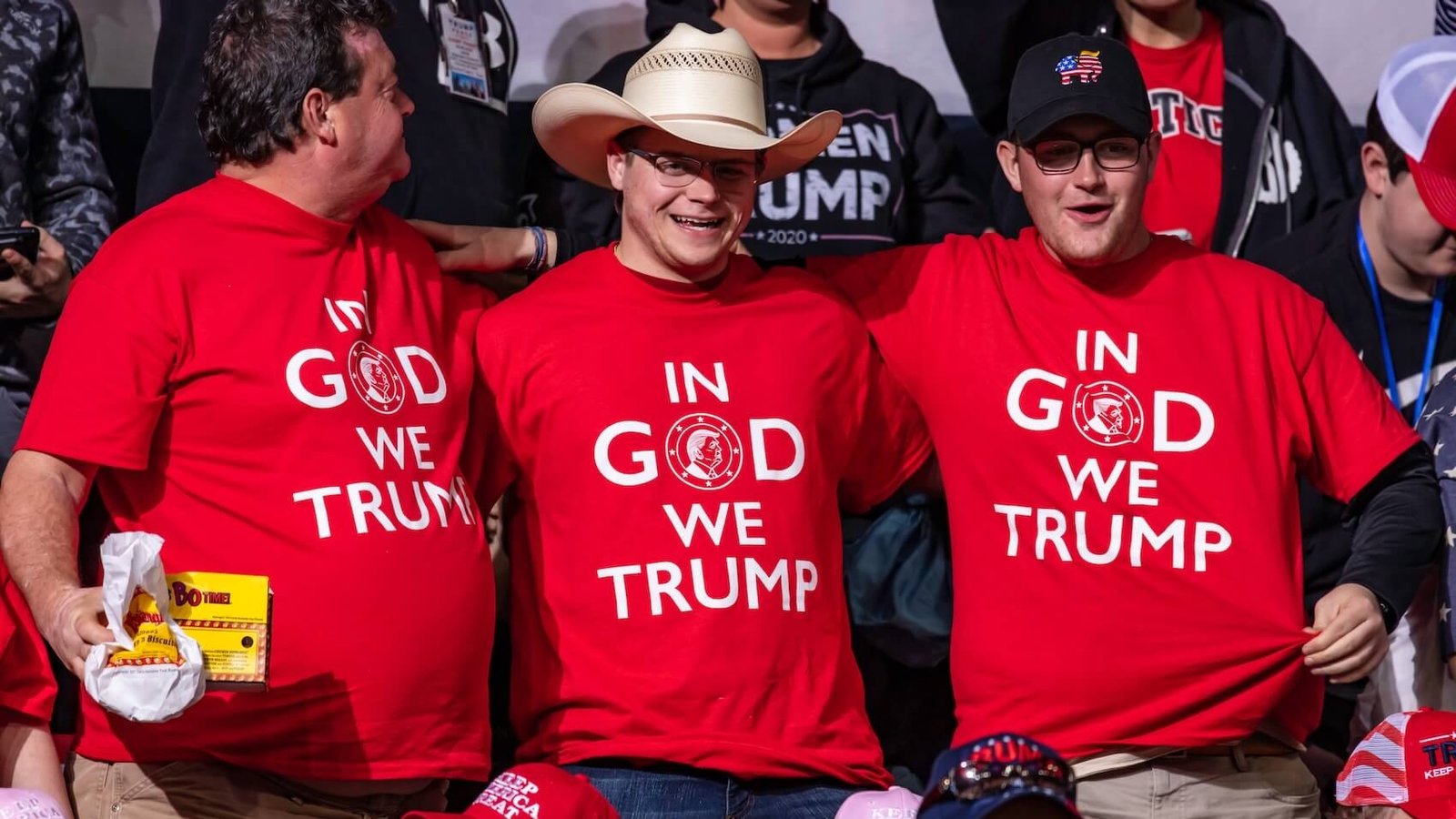 Donald Trump's supporters wearing "In God We Trump" shirts at a rally in Bojangles' Coliseum in Charlotte, North Carolina, on March 2, 2020. Photo: Jeffrey Edwards.