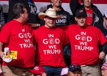 Donald Trump's supporters wearing "In God We Trump" shirts at a rally in Bojangles' Coliseum in Charlotte, North Carolina, on March 2, 2020. Photo: Jeffrey Edwards.