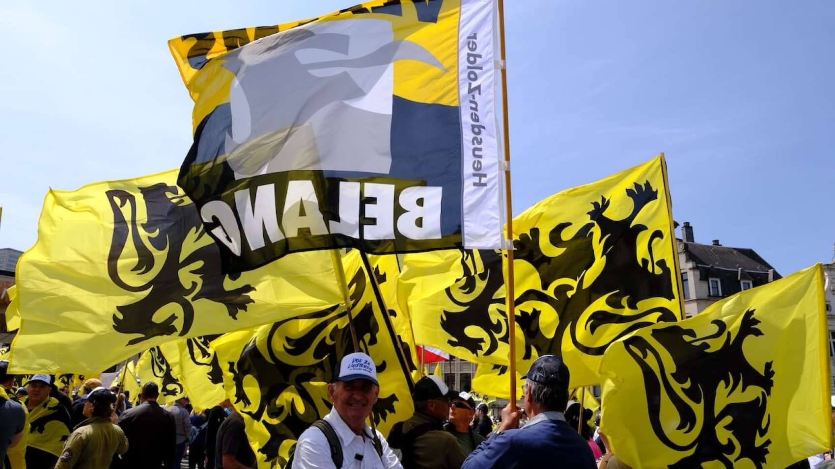 Supporters of the Flemish far-right party Vlaams Belang wave Flanders flags during a protest in Brussels, Belgium, on May 29, 2023. Photo: Alexandros Michailidis.