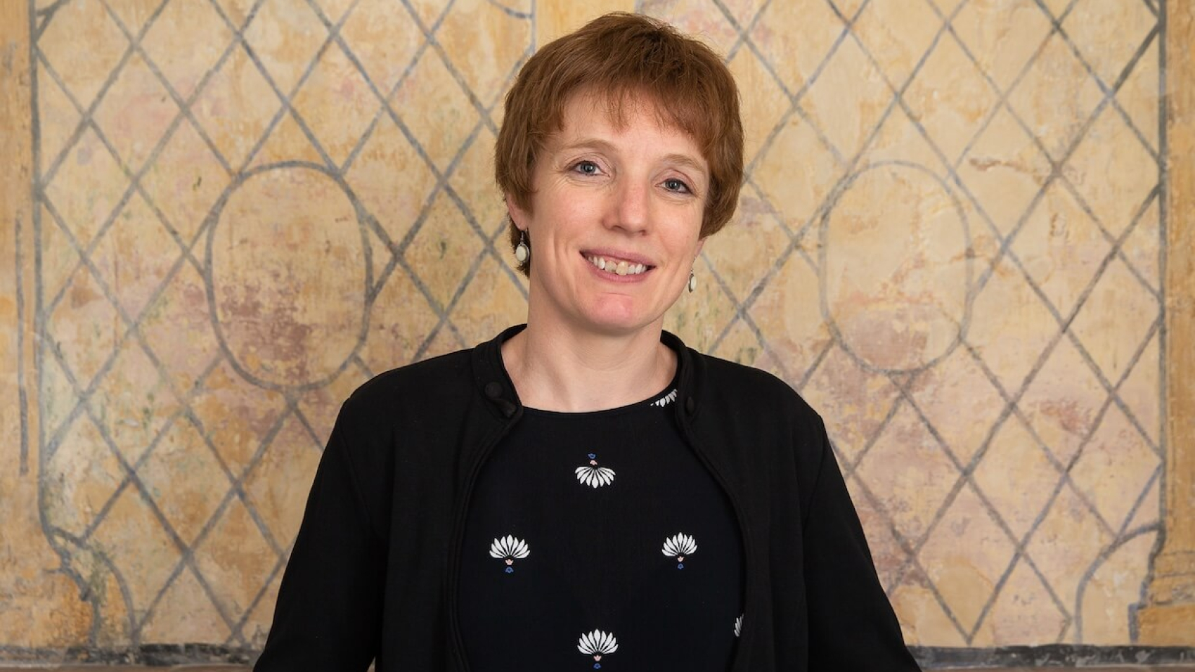 Dr. Ellen Desmet, an Associate Professor of Migration Law at Ghent University.