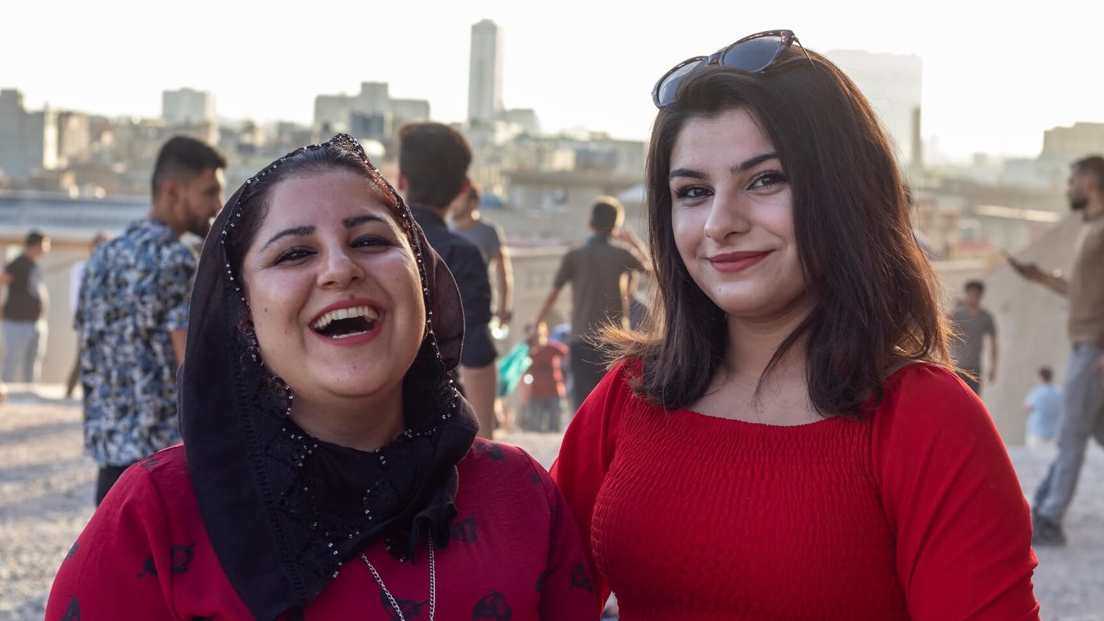 Young Kurdish women dressed in red in Erbil, Iraq, on September 10, 2021. Photo: Serhii Ivashchuk.