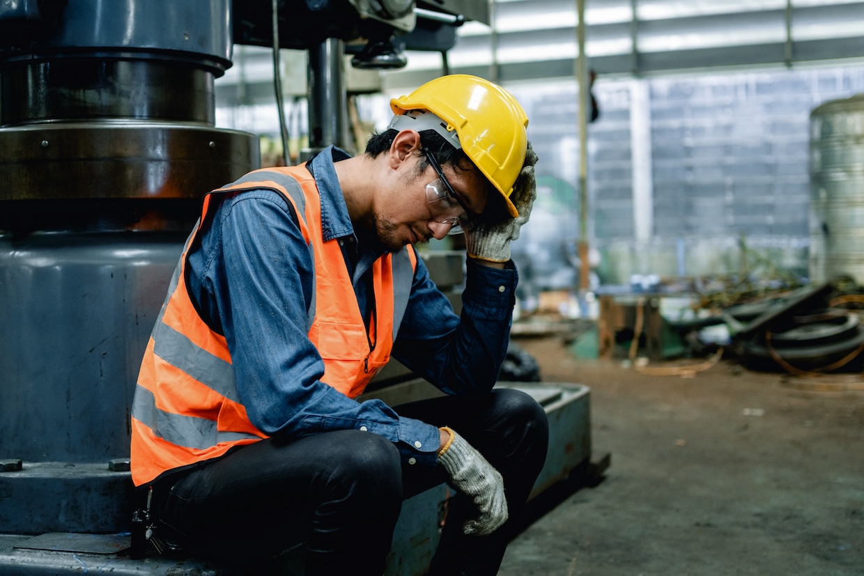 A fatigued factory worker.