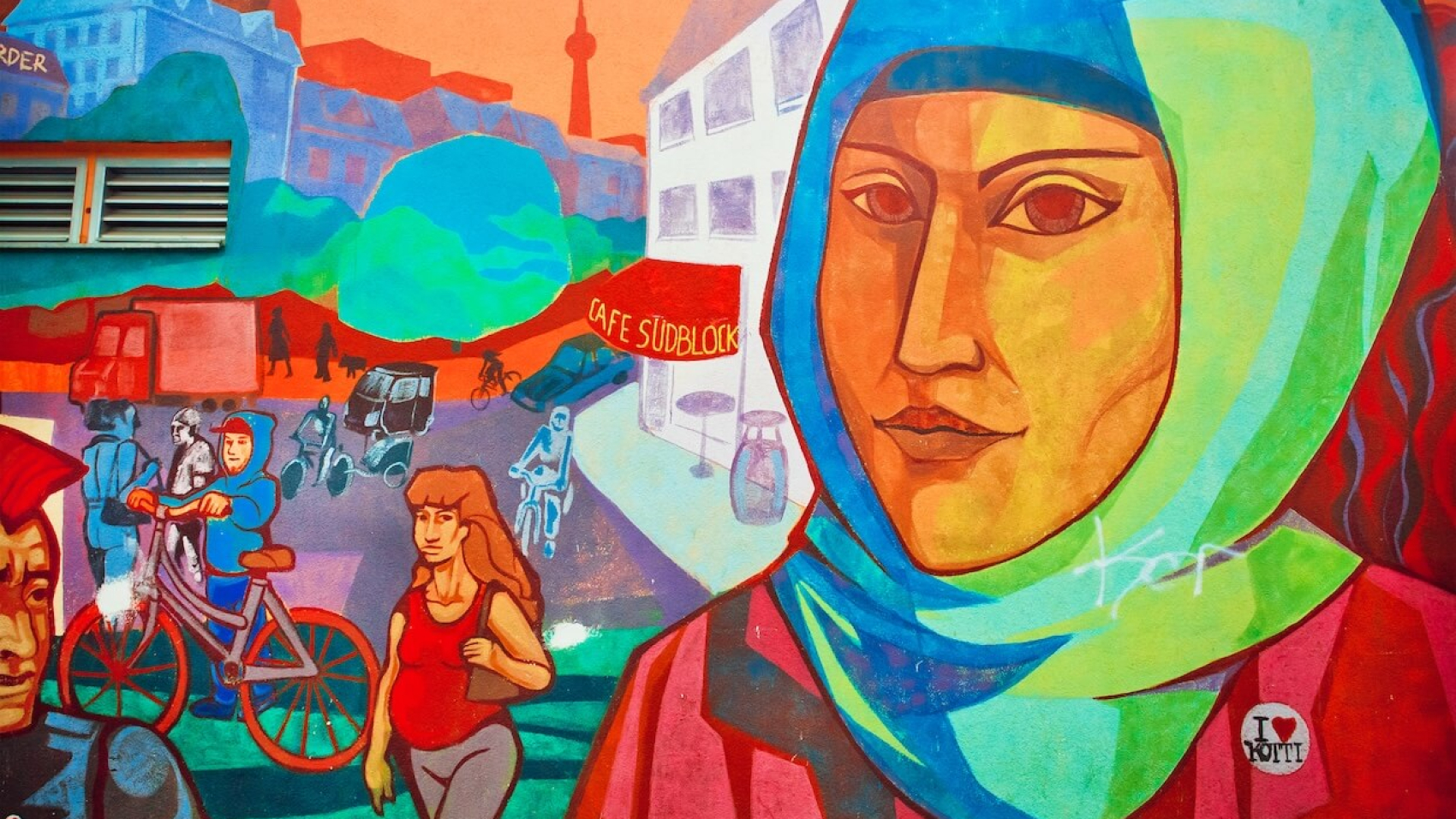 Urban graffiti depicting the face of a woman in a hijab, located in an immigrant-populated neighborhood on September 1, 2015. The urban area of Berlin, Germany—home to 4 million residents—ranks as the 7th most populous in the European Union. Photo: Dreamstime.