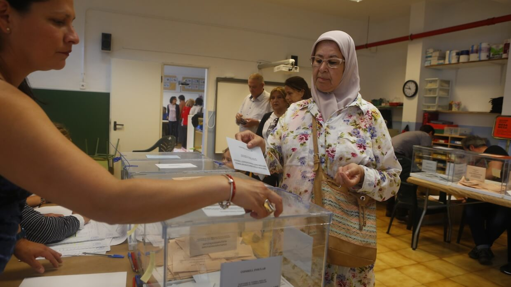 A woman votes at a polling station on general election day in Palma de Mallorca. Photo: Dreamstime.