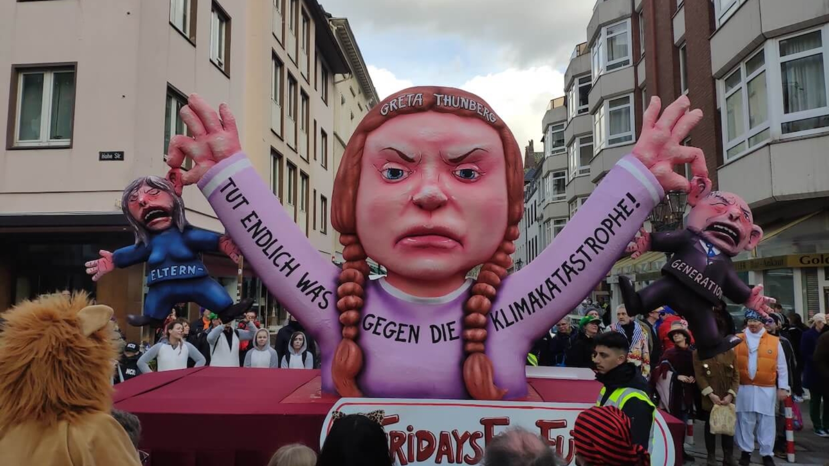 Carnival float showing Greta Thunberg holding the older generation by their ears, symbolizing "Fridays for Future" in Düsseldorf, Germany on March 3, 2019. Photo: Christian Drees.