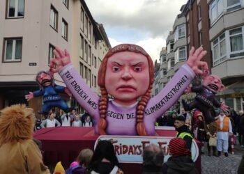 Carnival float showing Greta Thunberg holding the older generation by their ears, symbolizing "Fridays for Future" in Düsseldorf, Germany on March 3, 2019. Photo: Christian Drees.