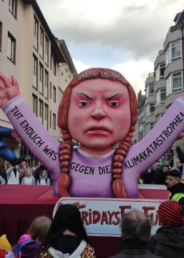 Carnival float showing Greta Thunberg holding the older generation by their ears, symbolizing "Fridays for Future" in Düsseldorf, Germany on March 3, 2019. Photo: Christian Drees.
