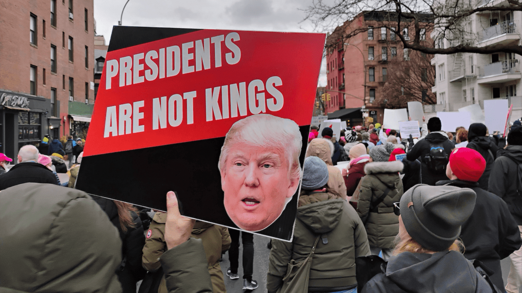 Demonstrators at The People’s March, an evolution of the Women’s March, NYC, January 18, 2025. A protester holds a sign reading “Presidents Are Not Kings.” Photo: Erin Alexis Randolph.