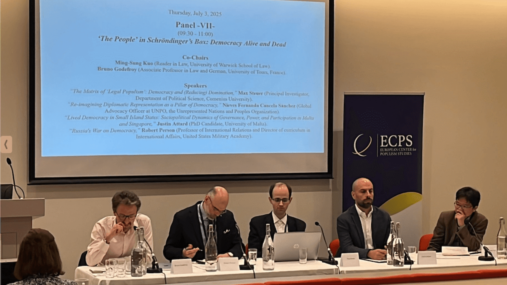 At Panel VII of the ECPS Conference 2025, titled “‘The People’ in Schrödinger’s Box: Democracy Alive and Dead,” scholars Max Steuer, Justin Attard, and Robert Person explored legal populism, democratic life in small island states, and authoritarian aggression in Russia’s war on democracy. Co-chaired by Ming-Sung Kuo and Bruno Godefroy.