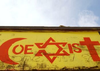 Graffiti artwork promoting religious tolerance, as Bristol City Council consulted the public on whether it should remain or be removed, August 31, 2009, Bristol, UK. Photo: Dreamstime.