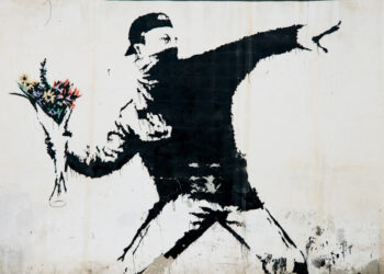 Banksy protest mural in Palestine. A mural by the artist Banksy on a wall in the West Bank village of Beit Sahour, June 18, 2014. Photo: Dreamstime.