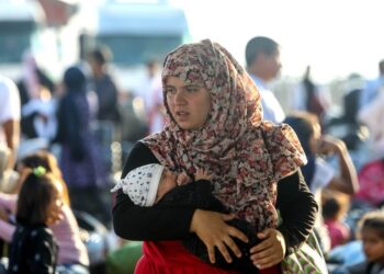 Refugees and migrants disembark at the port of Thessaloniki after being transferred from the Moria refugee camp on Lesvos Island, Greece, September 2, 2019. Photo: Vasilis Ververidis.