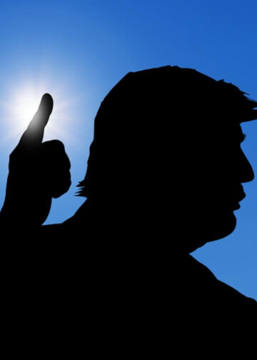 Silhouette of US President Donald Trump attending a conference. Photo: Dreamstime.