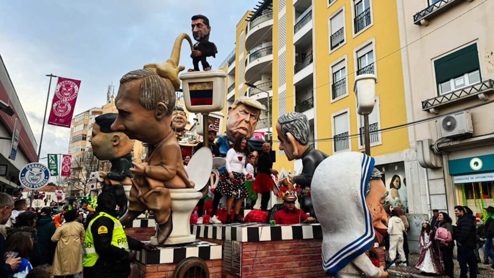 Satirical carnival parade with caricatured sculptures and enthusiastic spectators in Torres Vedras, Portugal on March 4, 2025. Photo: Dreamstime.