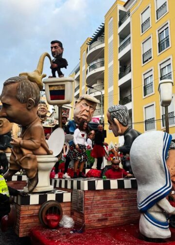 Satirical carnival parade with caricatured sculptures and enthusiastic spectators in Torres Vedras, Portugal on March 4, 2025. Photo: Dreamstime.