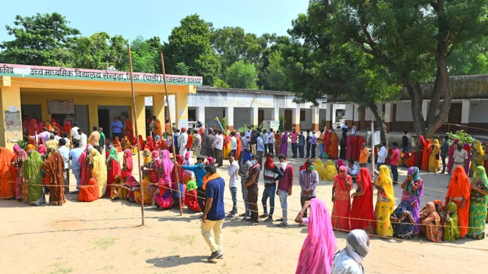 Voters queue at a polling station in Sendra village near Beawar during the Panchayati Raj elections in India on September 28, 2020, held amid the COVID-19 pandemic, with turnout exceeding 83 percent in the first phase across 25 districts. Photo: Dreamstime.