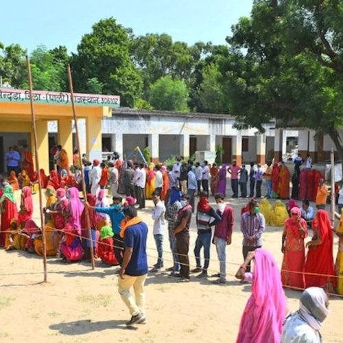 Voters queue at a polling station in Sendra village near Beawar during the Panchayati Raj elections in India on September 28, 2020, held amid the COVID-19 pandemic, with turnout exceeding 83 percent in the first phase across 25 districts. Photo: Dreamstime.