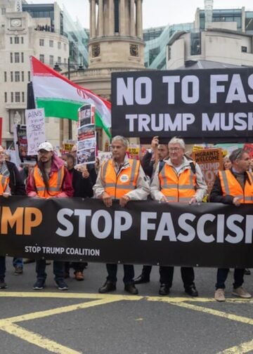 Stop Trump Coalition march, Central London, United Kingdom, September 17, 2025. A protester holds a sign reading &ldquo;No to fascists &mdash; Trump, Musk, Farage.&rdquo; Photo: Ben Gingell.