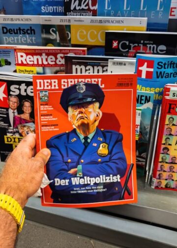 German press kiosk in Trier with Der Spiegel featuring Donald Trump as “world policeman” on the cover on July 3, 2025. Photo: Dreamstime.