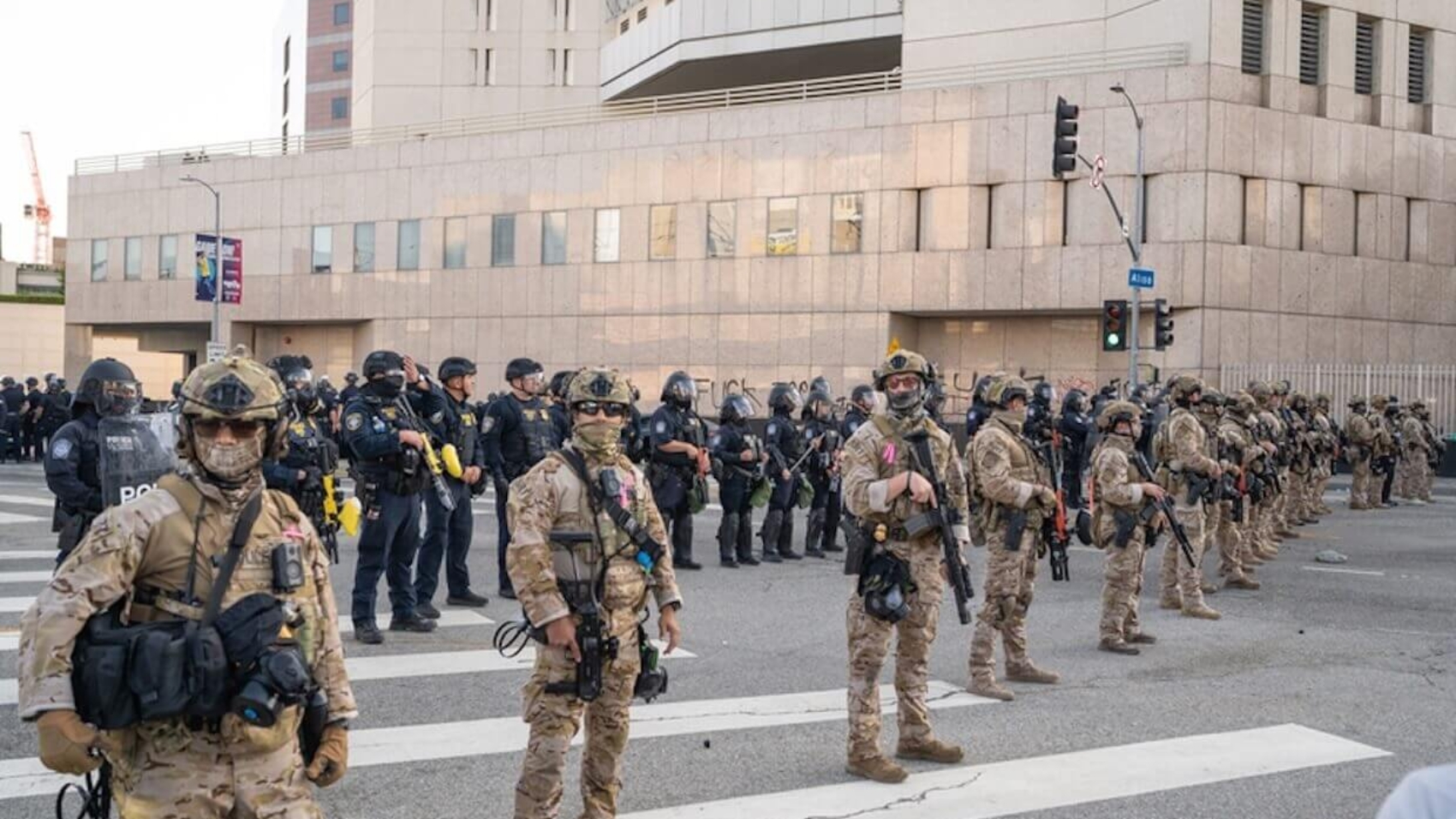 National Guard troops stand on standby during a downtown demonstration opposing expanded ICE operations and supporting immigrant rights in Los Angeles, United States, June 8, 2025. Photo: Brphoto | Dreamstime.