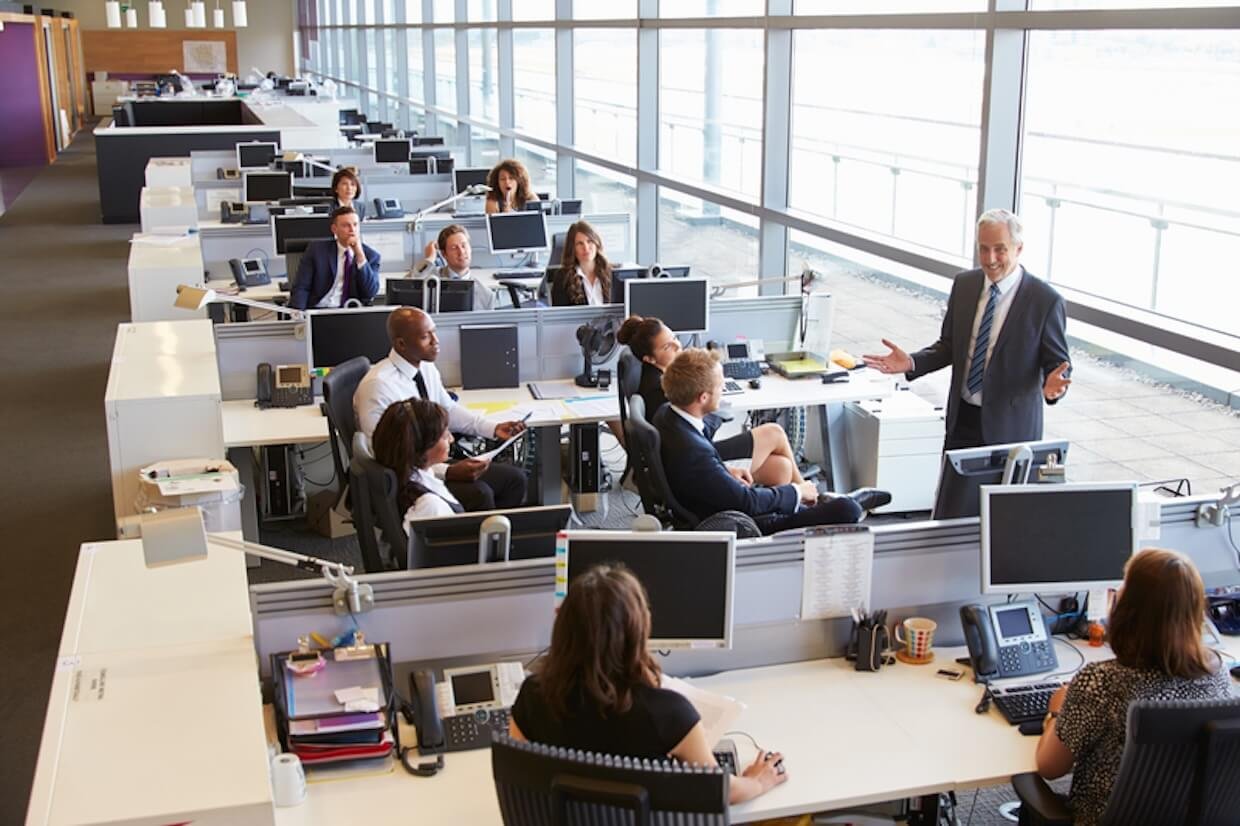 Senior male manager addressing workers.