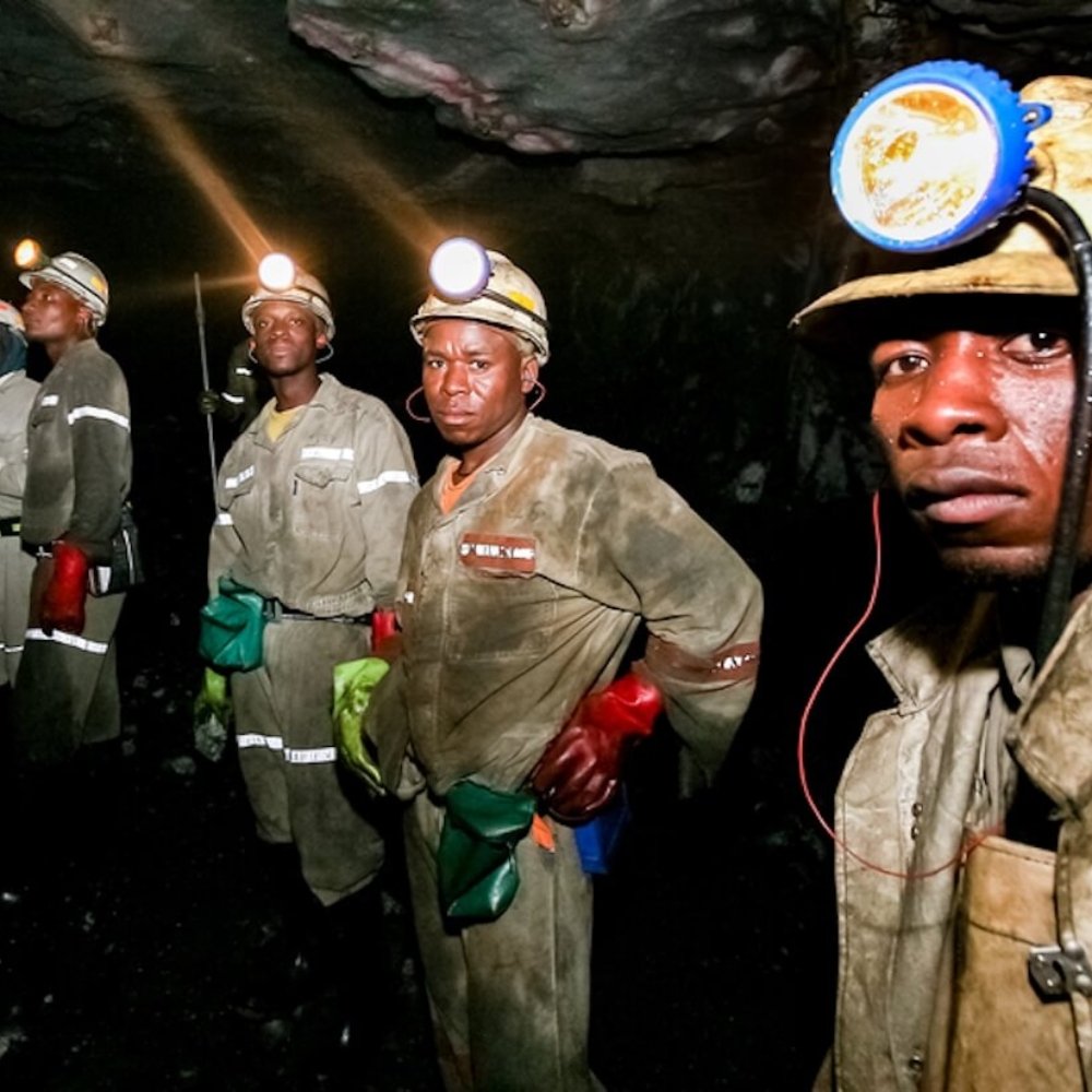 Underground platinum and palladium mining operations and machinery in Johannesburg.
