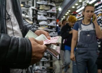 A man counts money.